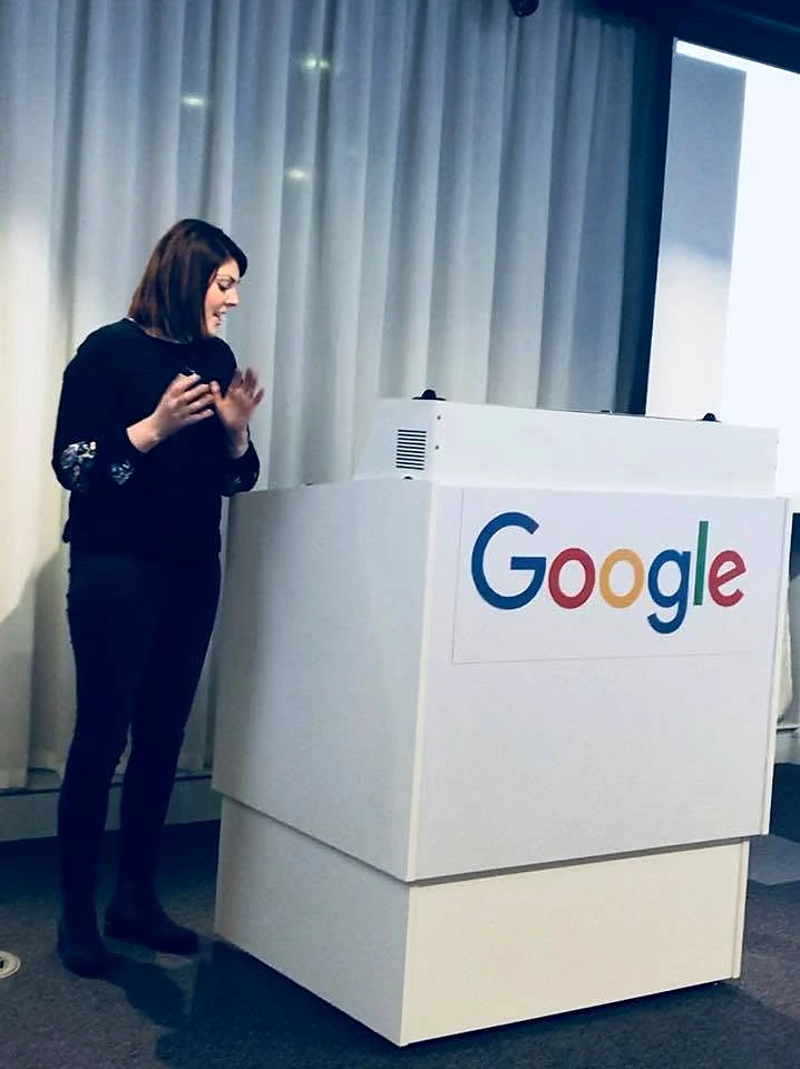 Sarah Jane Vincent speaking beside a Google-branded lectern